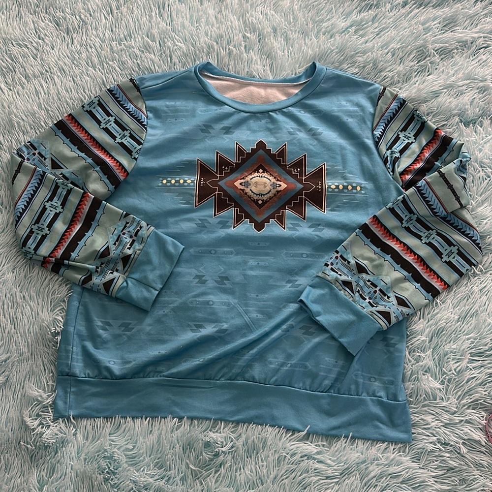 Smooth long sleeve top in soft material. Aztec tribal print. Generous fit. NWOT.